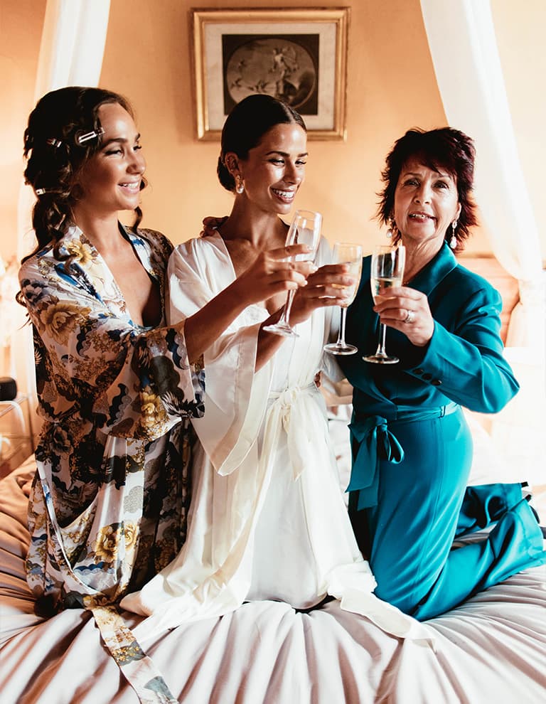 bridal party celebrating while getting ready
