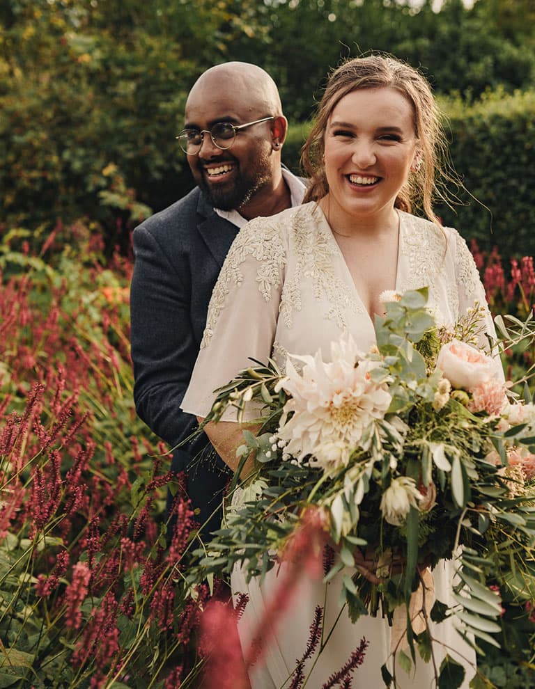  bride and groom  at their floral garden wedding