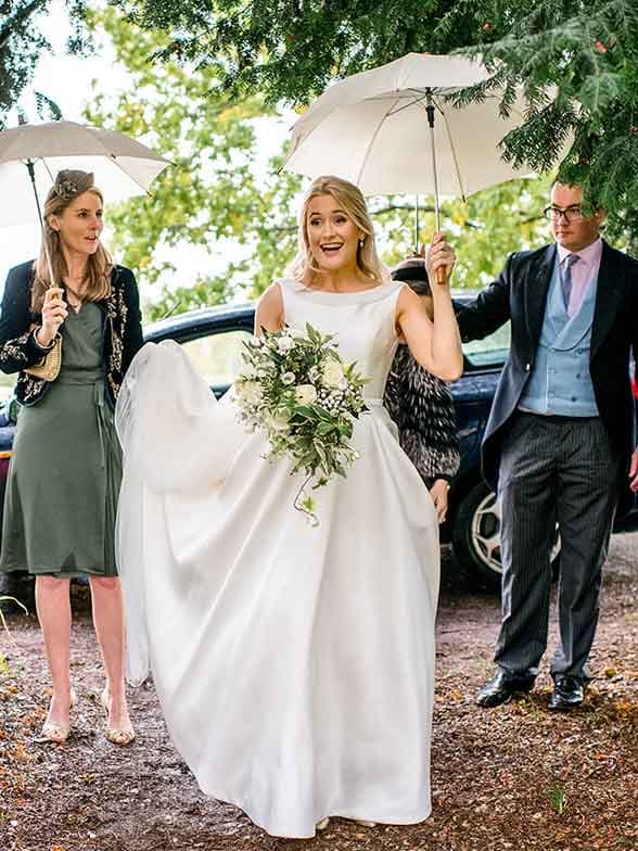 bride arrives at the barn wedding venue