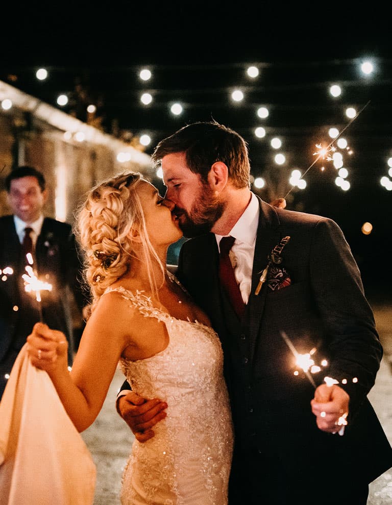 small wedding bride and groom with sparklers