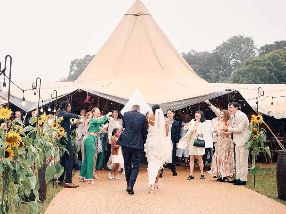 just married couple arrives to their marquee wedding venue