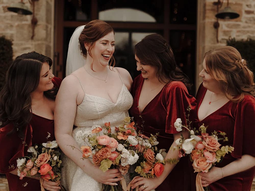 bride and bridesmaids holding matching bouquets