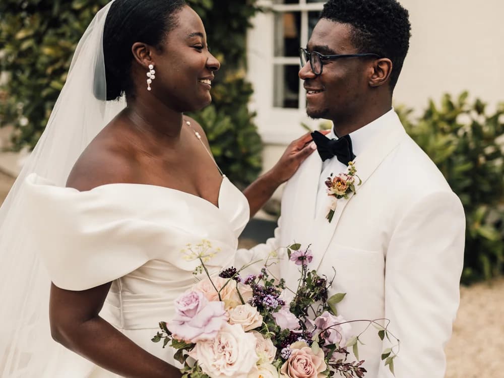 bride and groom with matching flower buttonhole