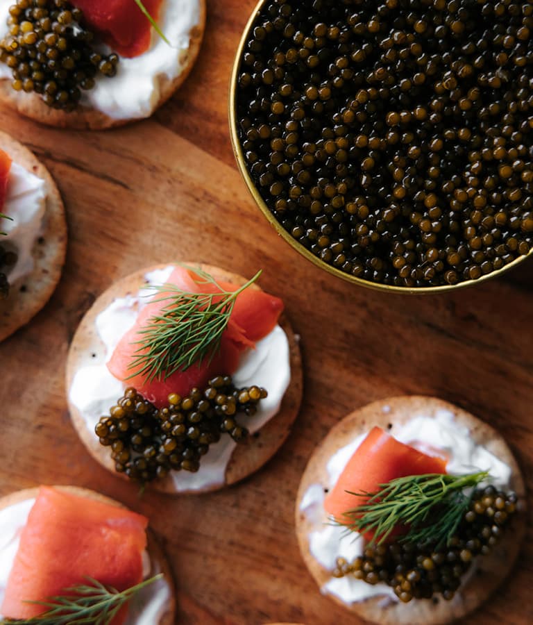 birds eye view caviar crackers and bowl of caviar