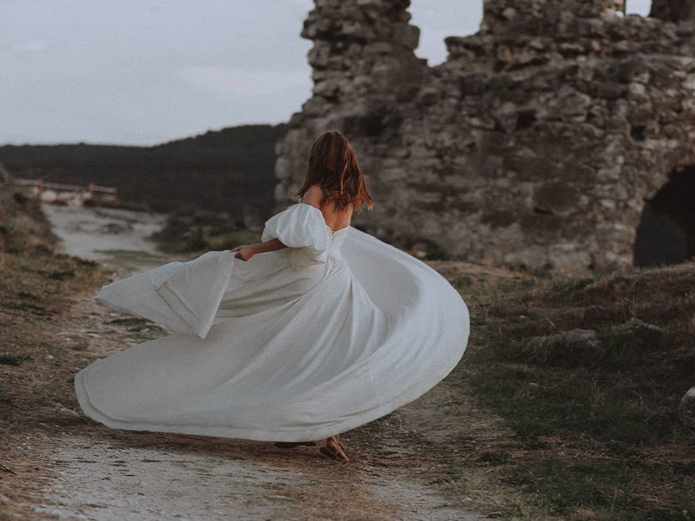 Bride twirls in romantic wedding dress
