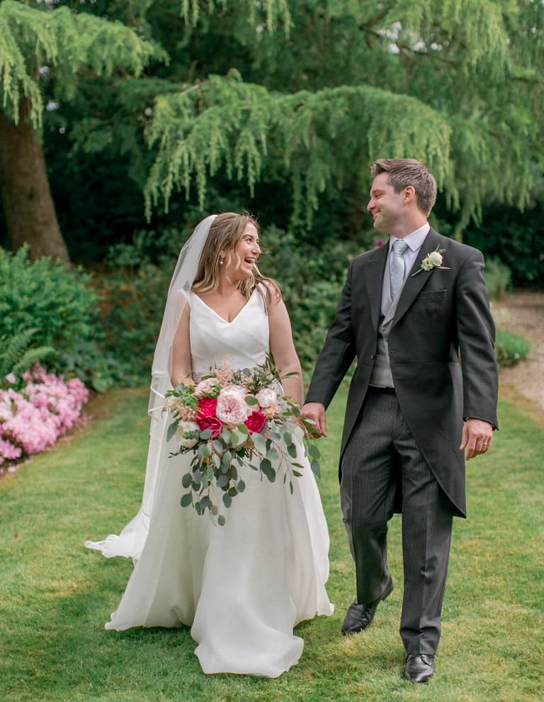 Bianca and Matt with wedding bouquets and hot pink flowers