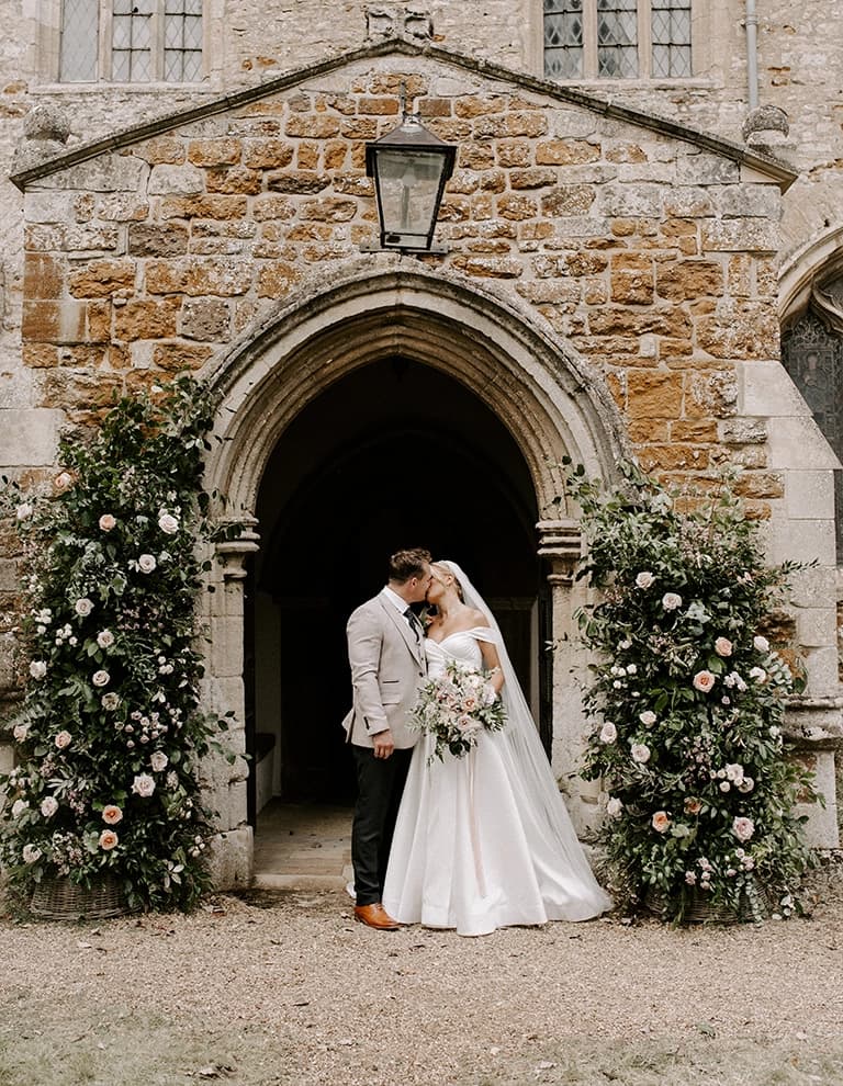 Pip and Michael outside traditional church