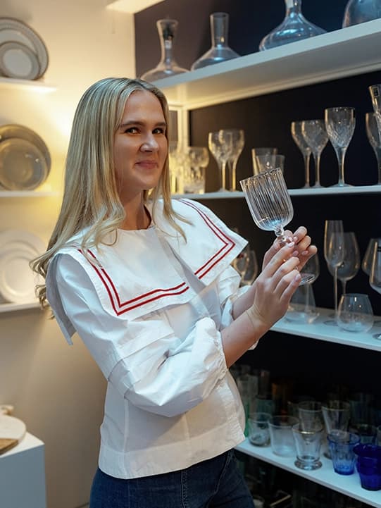 Matilda Bea choosing wine glasses