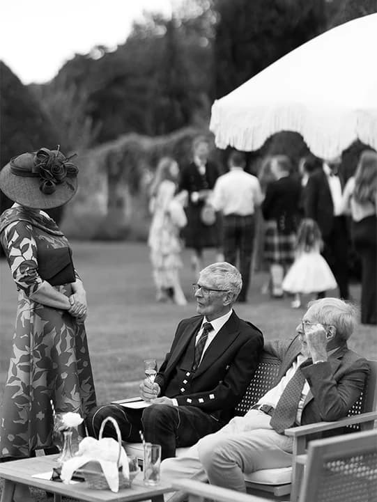 Wedding guests enjoy drinks at the wedding reception