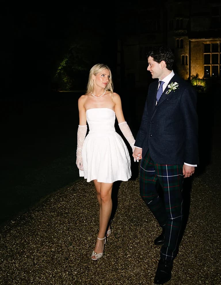 Groom and bride wearing short bridal party dress and gloves