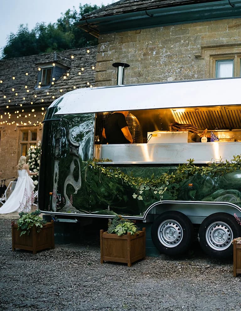 Pizza truck with festoon lights at Brympton House