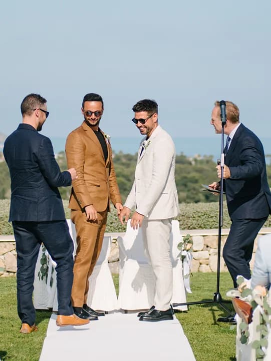 ring bearer brings rings during a same-sex wedding ceremony with celebrant