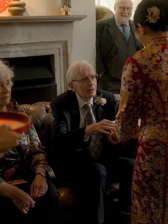 Bride in Kua serves tea to elders during tea ceremony