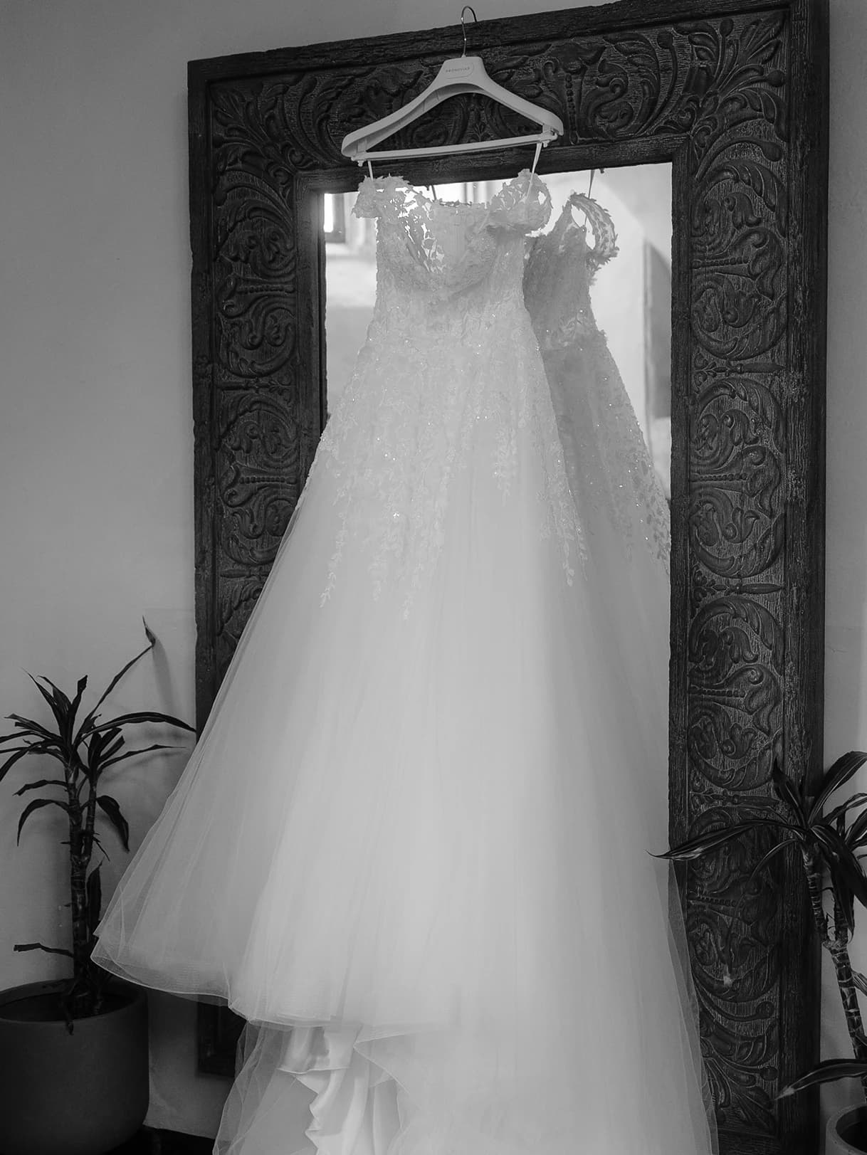 Bridal gown hanging on a mirror