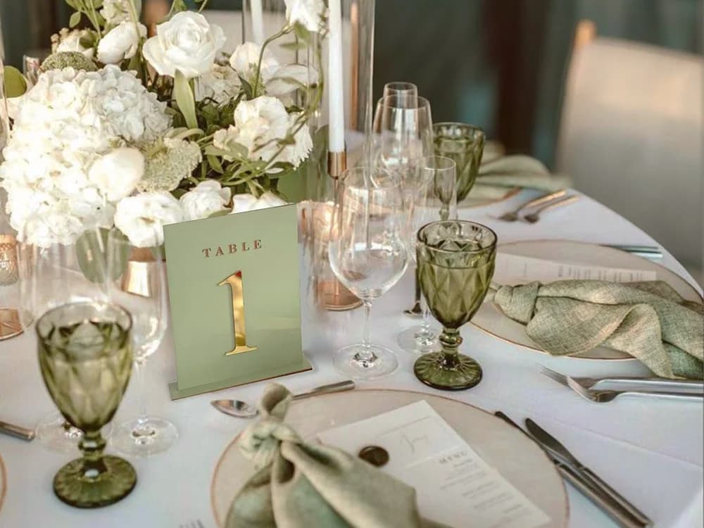 A wedding table set in a sage colour palette