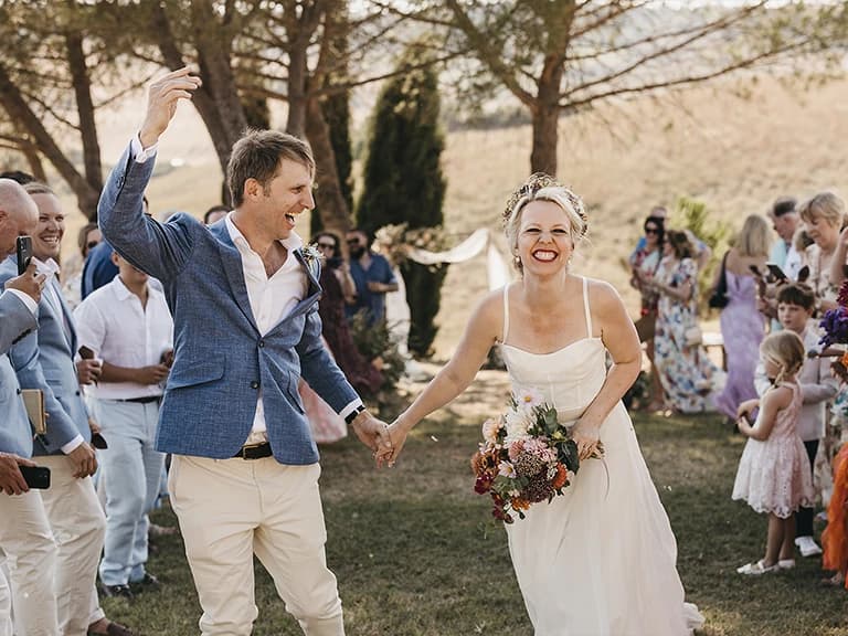 Just-married couple celebrates after their destination wedding ceremony